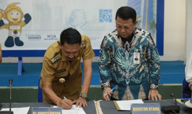 Pj Bupati Buton Teken Perjanjian Kerjasama Penerbitan Kartu Kredit Pemerintah Daerah